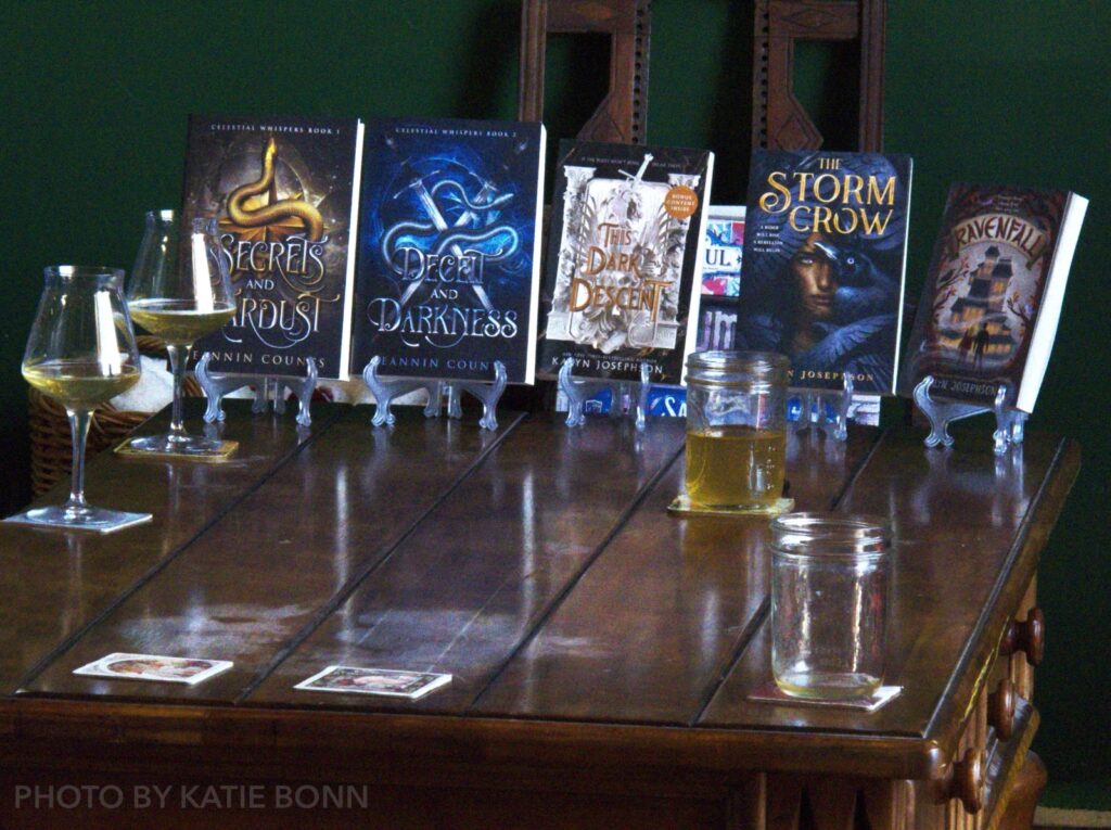 The authors' books among glasses of locally-made cider
